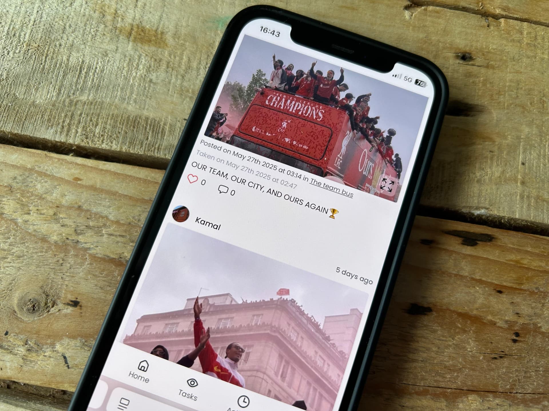 A phone screen showing a parade celebration post from the official team perspective, representing how organisations naturally capture the stage view of an event.