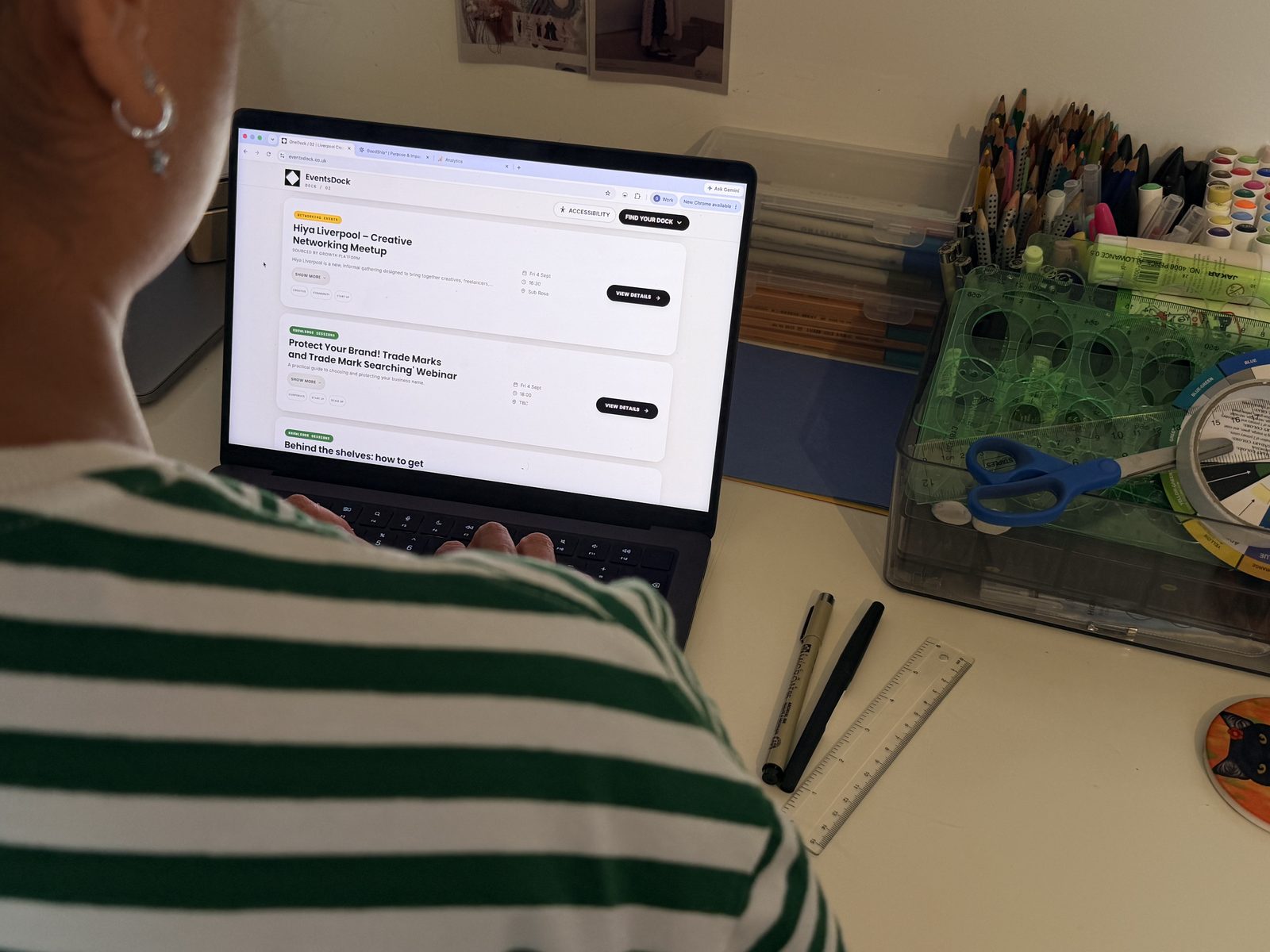 Someone browsing upcoming Liverpool events on the EventsDock listings page on a laptop